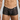 Black lace boxer underwear worn by a person on a plain background