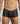 Black lace boxer underwear worn by a person on a plain background